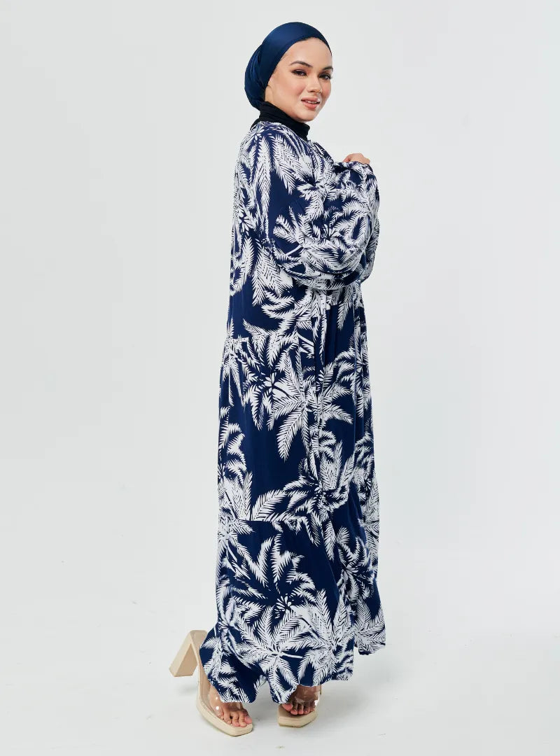A woman dressed in Coconut Navy The Bloom