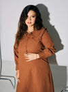 A woman dressed in Ginger Brown Marsya Cotton Long Sleeve Dress