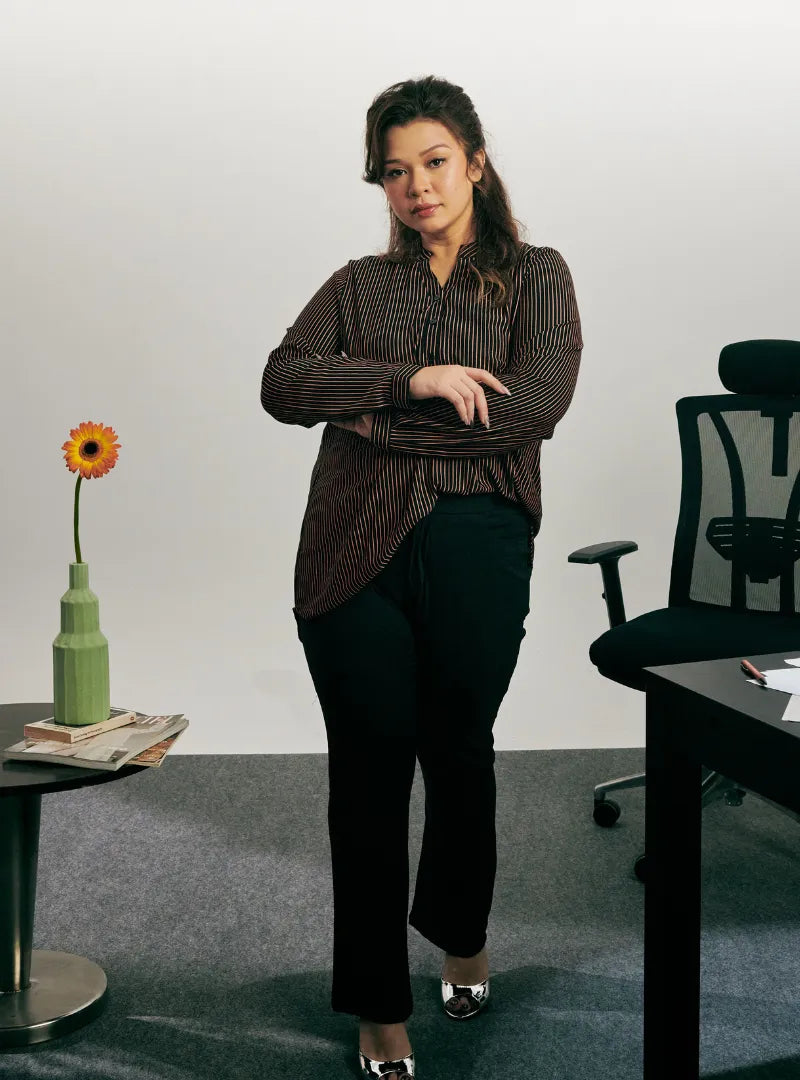 A woman dressed in Ginger Miyo Mandarin Collar Striped Polo Shirt