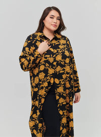 A woman dressed in Gold Chrysanthemum Flower Longline Printed Shirt Dress