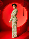 A woman dressed in Green Rose Han Jie Cheongsam Dress