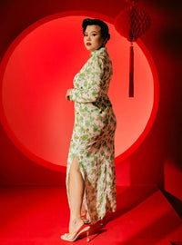 A woman dressed in Green Rose Han Jie Cheongsam Dress