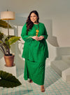 A woman dressed in Green Tun Inna Kurung