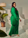 A woman dressed in Green Tun Inna Kurung