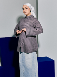 A woman wearing Grey Janiper Striped Shirt