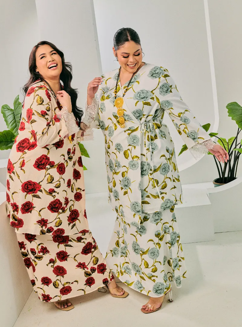 Two women dressed in Grey and Red Tun Bunga Printed Wrap Kurung