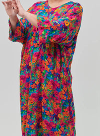 A woman dressed in Hot Pink Garden Essential Front Knot Kaftan