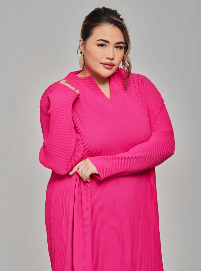 A woman dressed in Hot Pink Tun Aimellia Pleated Maxi Dress