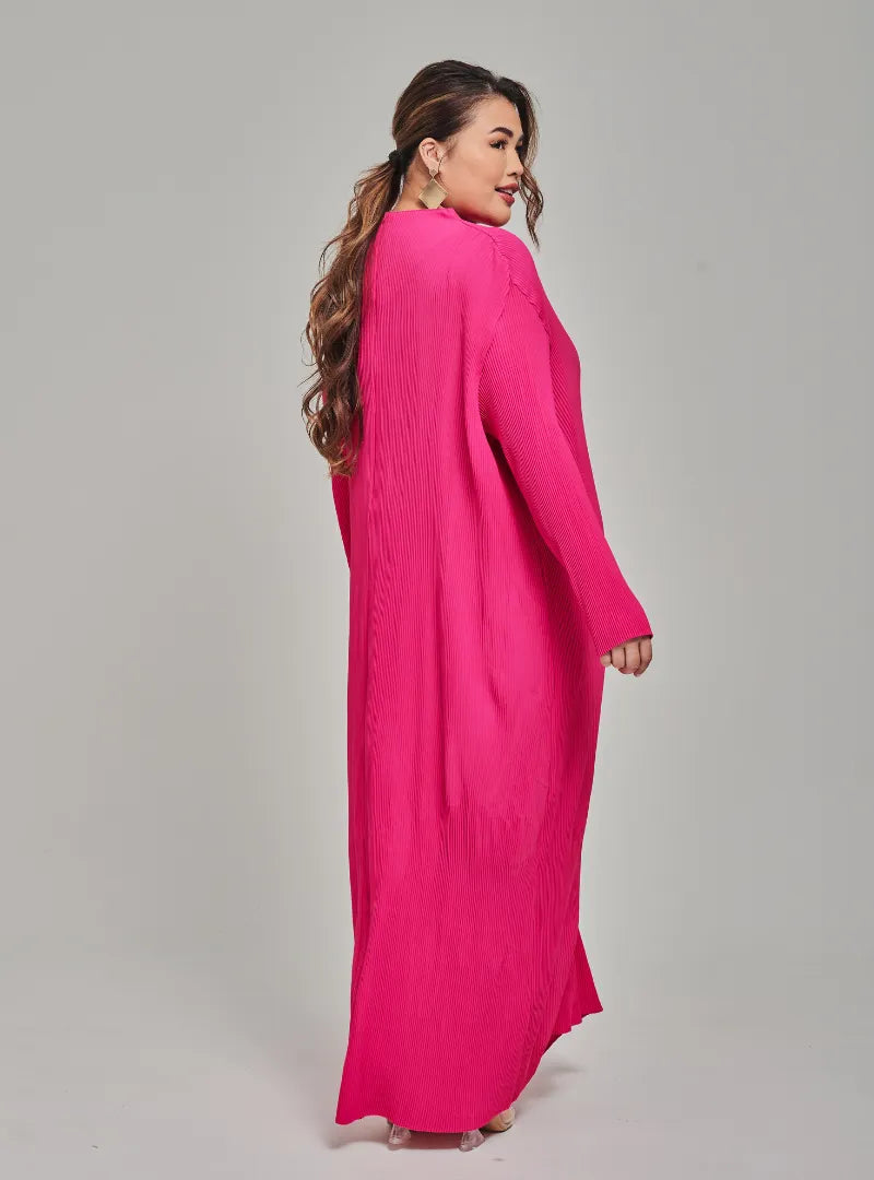 A woman dressed in Hot Pink Tun Aimellia Pleated Maxi Dress