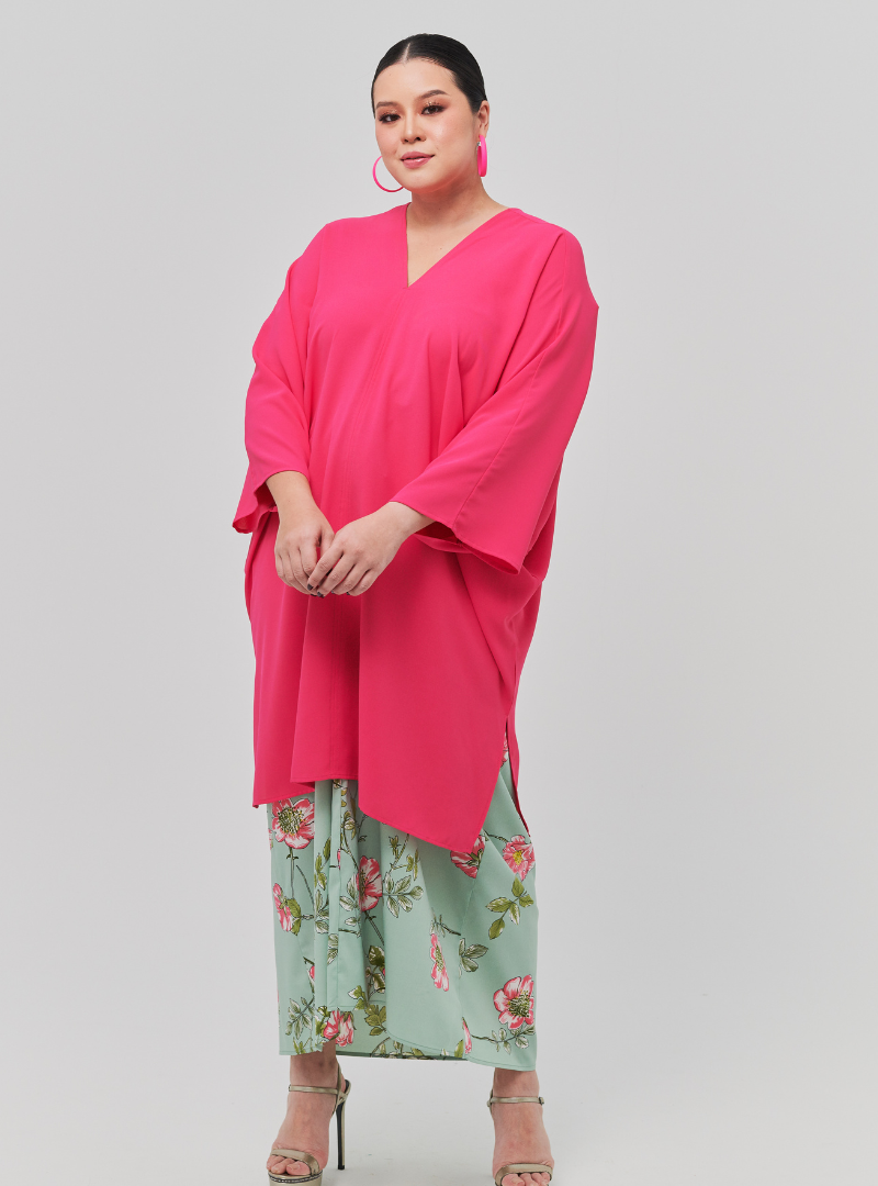 A woman dressed in Hot Pink Tun Fatima Kaftan Top