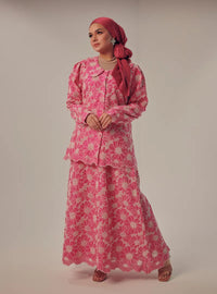 A woman dressed in Hot Pink Tun Habiba Eyelet Set