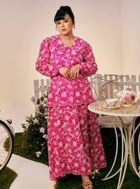 A woman dressed in Hot Pink Tun Habiba Eyelet Set