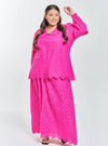 A woman dressed in Hot Pink Tun Hasmah Eyelet Skirt Set