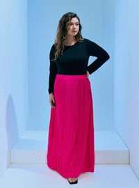 A woman wearing in Hot Pink Tun Izzah Pleated Skirt