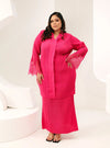 A woman dressed in Hot Pink Tun Jamilah Pleated Kurung