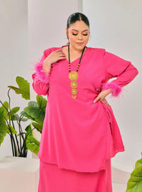 A woman dressed in Hot Pink Tun Malika Feather Wrap Kurung