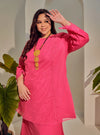 A woman dressed Hot Pink Tun Melur Dotted Kurung Pahang-