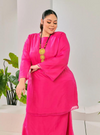 A woman dressed in Hot Pink Tun Sharimah Organza Kurung