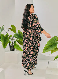 A woman dressed in Jowo Black The Vintage Opah Kurung