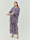 A woman dressed in Jowo Purple The Vintage Opah Kurung