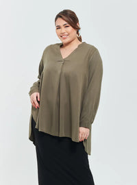 A woman dressed in Khakis Mandarin Collar Oversized Shirt