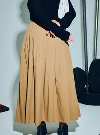 A woman wearing Latte Harper Poplin Skirt