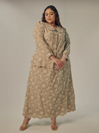 A woman dressed in Latte Tun Habiba Eyelet Set