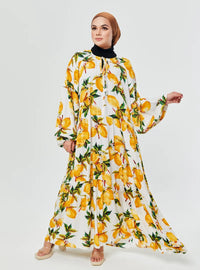 A woman dressed in Lemon Garden The Bloom