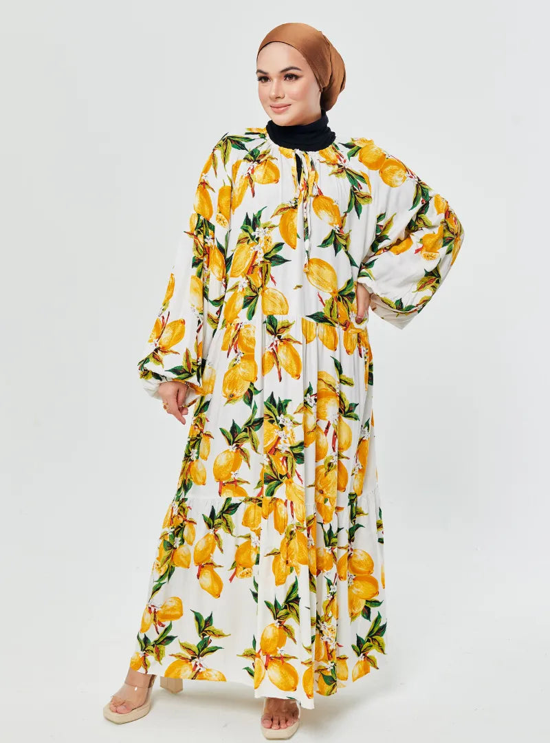 A woman dressed in Lemon Garden The Bloom