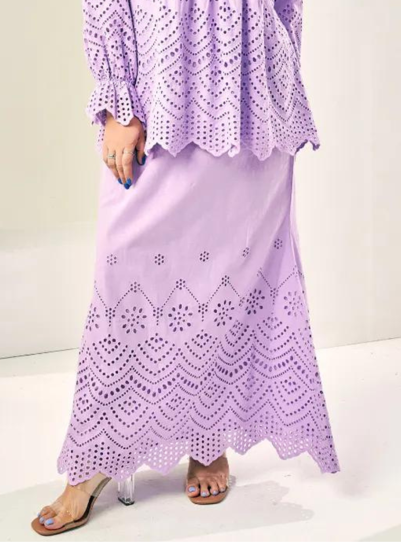 A woman wearing Lilac Ezzah Eyelet Doll Skirt