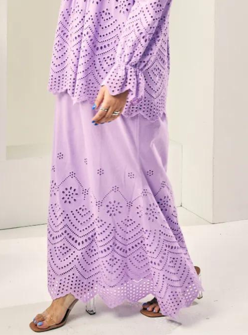 A woman wearing Lilac Ezzah Eyelet Doll Skirt