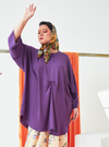 A woman dressed in Lilac Tun Bedah Top