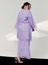 A woman dressed in Lilac Tun Sharimah Organza Kurung