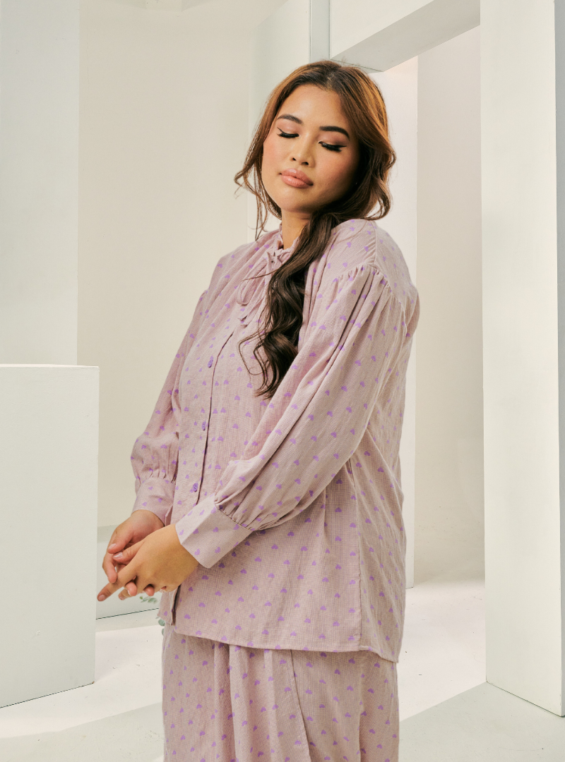 A woman dressed in Lilac Tun Zamira Love Shaped Polka Dotted Top Only