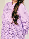 A woman dressed in Lilac Ezzah Eyelet Doll Top