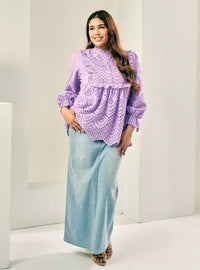 A woman dressed in Lilac Ezzah Eyelet Doll Top