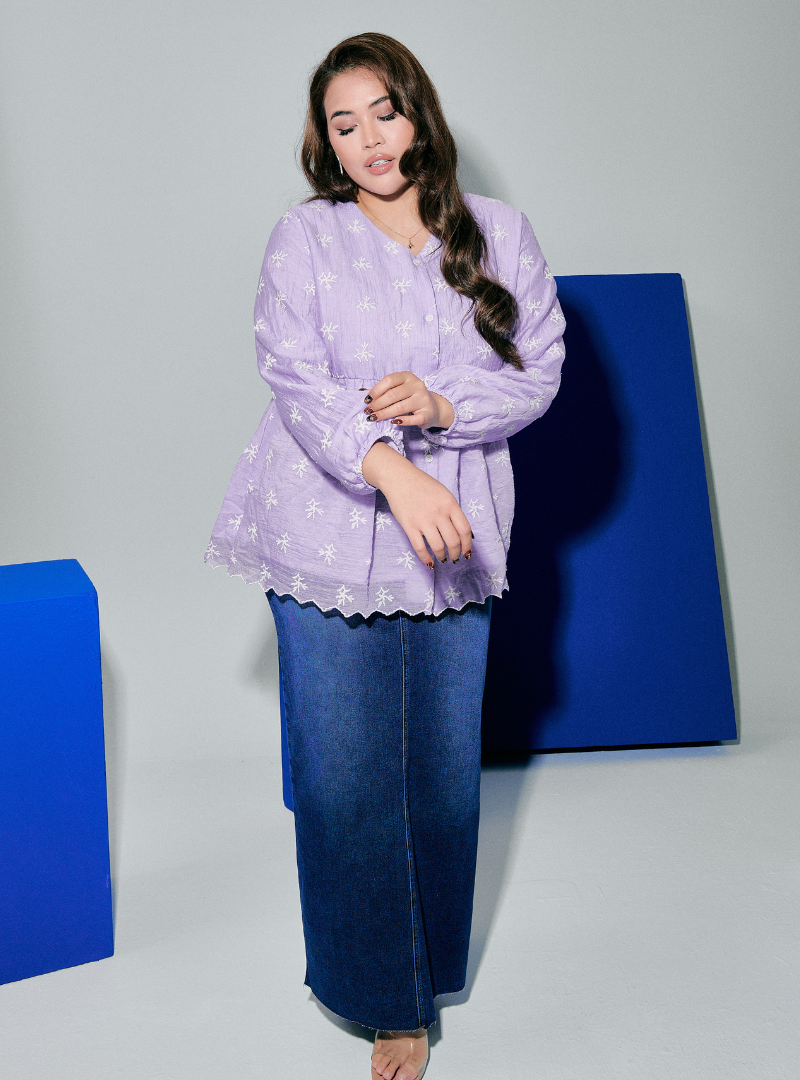 A woman dressed in Lilac Tun Ava Embroidered Top