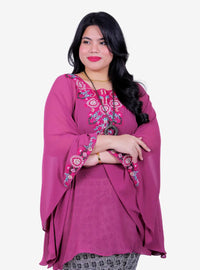 A woman dressed in Magenta Cik Kembang Batwing