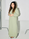 A woman dressed in MInt Green Marsya Cotton Long Sleeve Dress