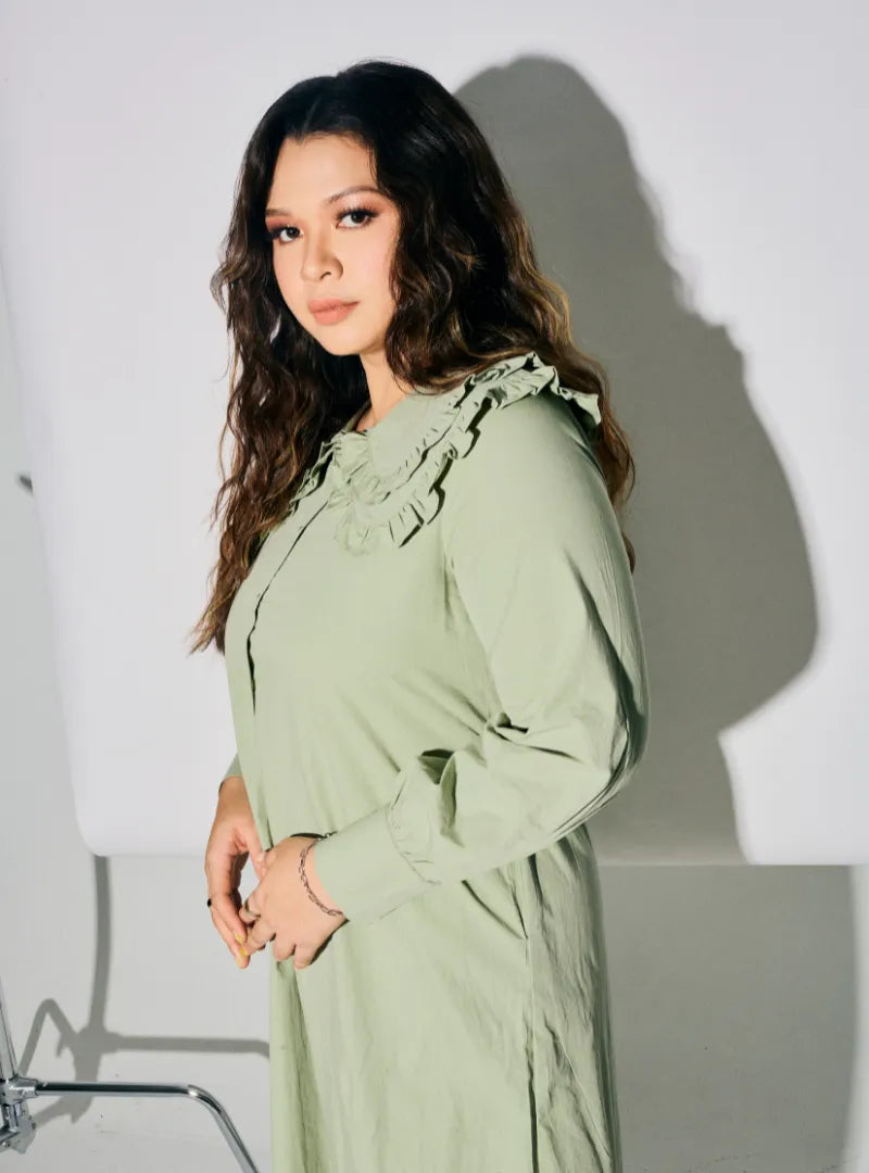 A woman dressed in MInt Green Marsya Cotton Long Sleeve Dress