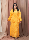 A woman dressed in Yellow Ms Aminah 3D Pleated Frizzy Kurung Modern