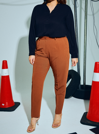 A woman wearing in Macchiato Audrey Skinny Slacks