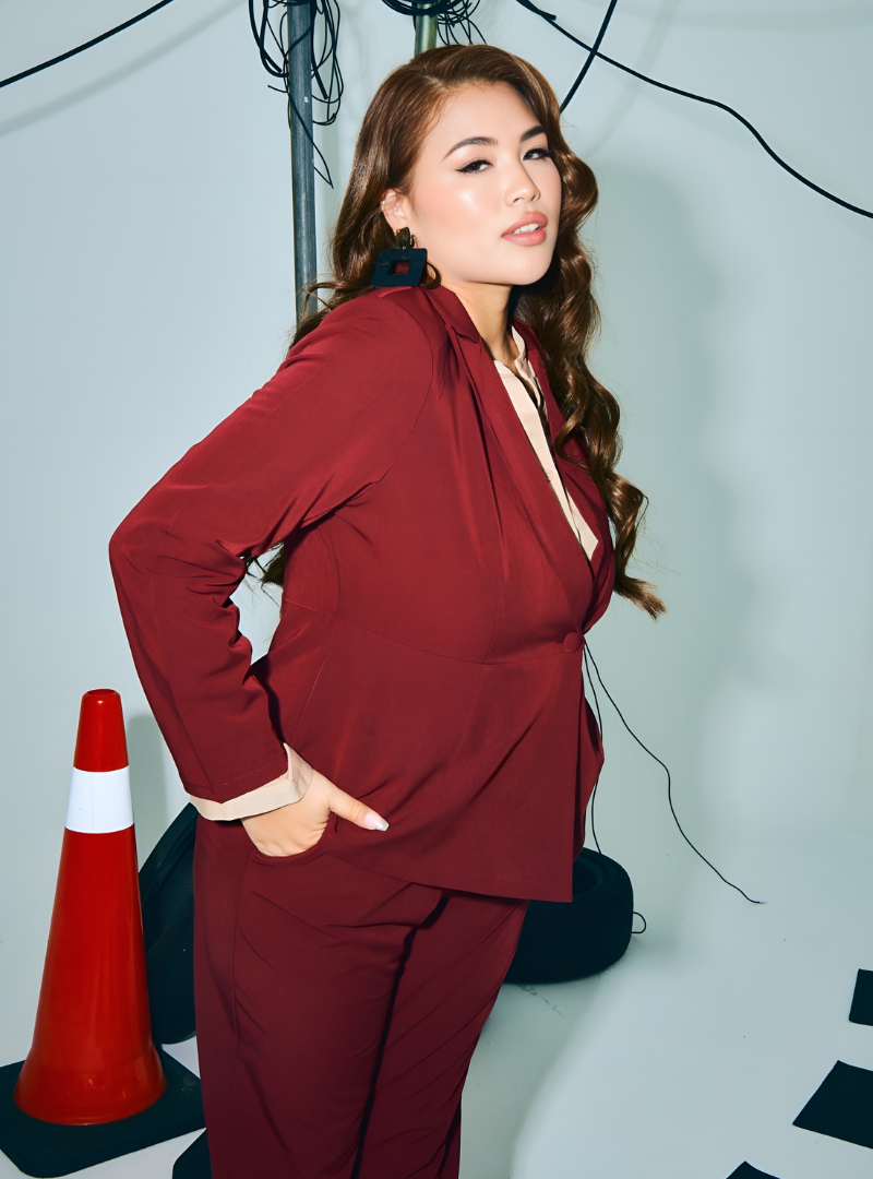 A woman wearing in Maroon Amber Peplum Blazer