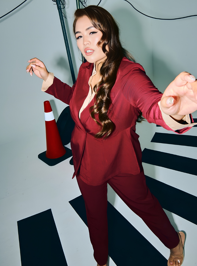 A woman wearing in Maroon Amber Peplum Blazer