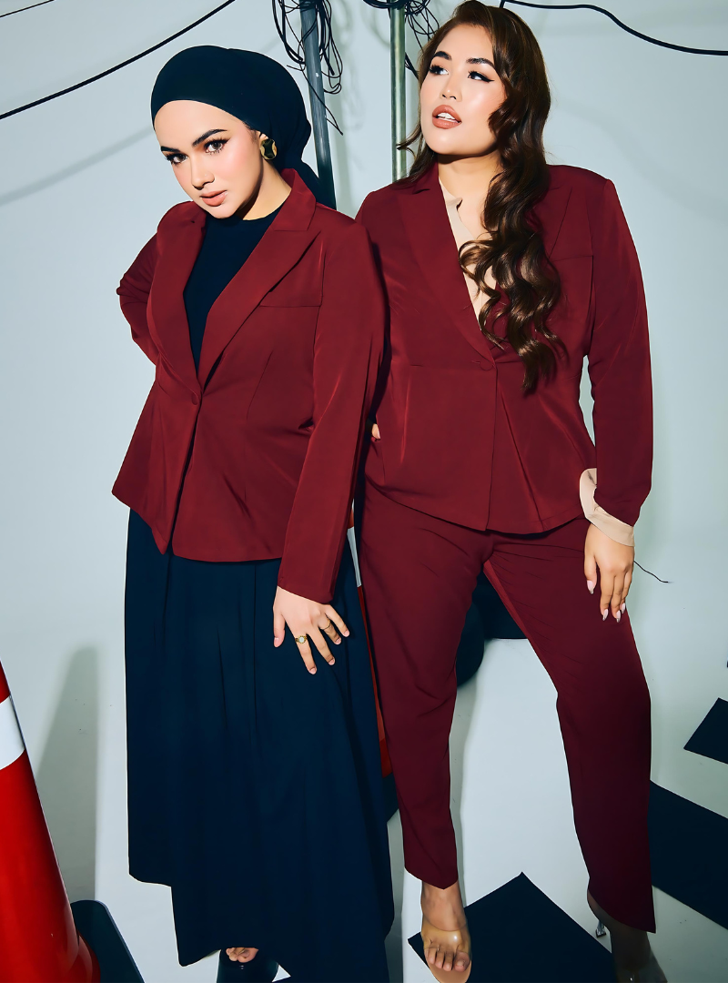 A woman wearing in Maroon Amber Peplum Blazer