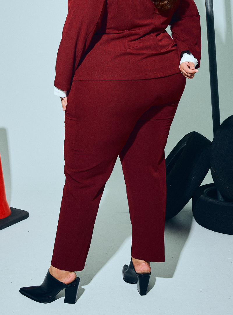 A woman wearing in Maroon Audrey Skinny Slacks 