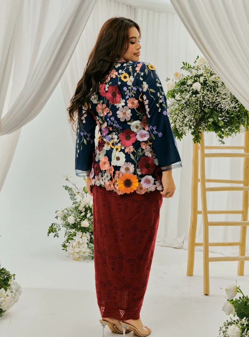 A woman dressed in Maroon Daisy Tun Jaeda Kebaya Nyonya Kurung