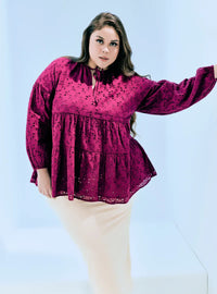 A woman dressed in Maroon Harley Eyelet Doll Top