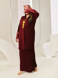 A woman dressed in Maroon Tun Jamilah Pletated Kebarung