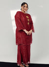 A woman dressed in Maroon Tun Sharimah Organza Kurung